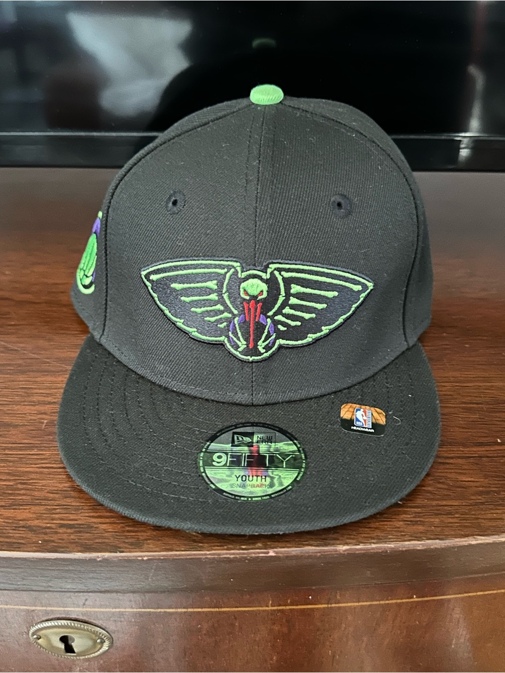 New Era Youth Black Snapback Hat with Green & Purple Wing Emblem